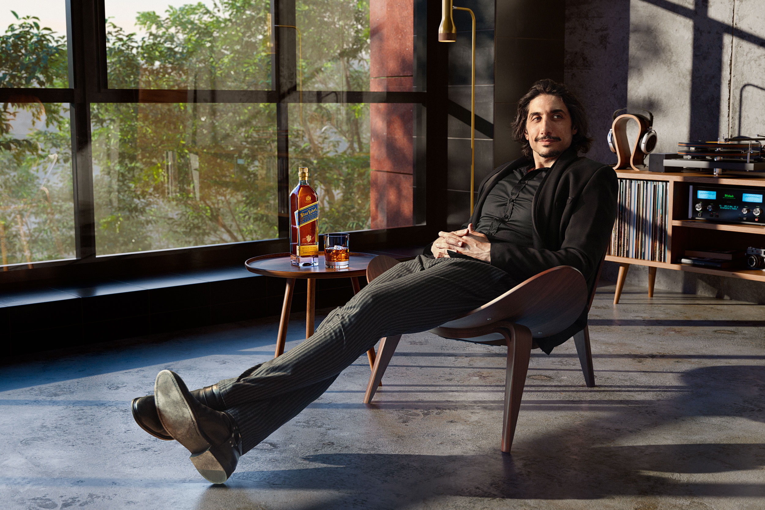 Actor Alexander Patsos in a CGI-built loft interior. One of the hybrid photography and CGI works that earned Dale May a place in Lürzer's Archive 200 Best Advertising Photographers Worldwide 2025/26.